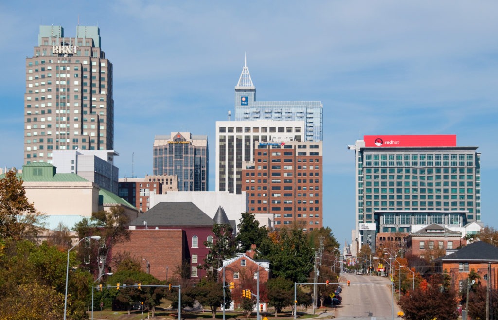 Downtown Raleigh North Carolina skyline with suburban homes